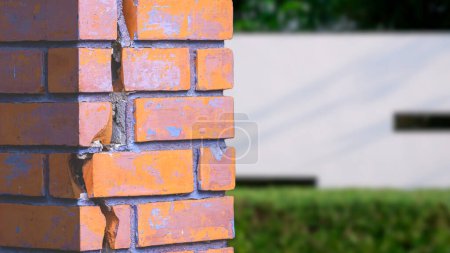 Photo for Crack line texture on the old damaged rectangle brick column outside of house, close up shot and perspective view with copy space - Royalty Free Image