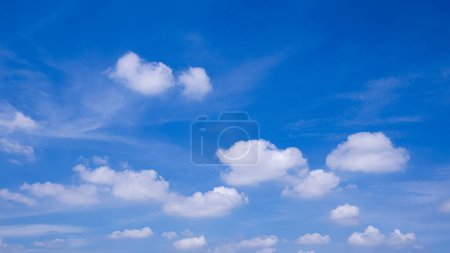 Photo for Blue sky background with many white fluffy clouds on daylight pastel sky, beautiful cloudscape view - Royalty Free Image