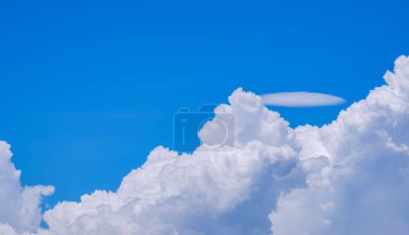 Photo for White Cumulus congestus and Pileus clouds on blue sky background in sunny day - Royalty Free Image