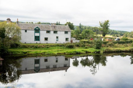 Photo for Reflection of a countryside house in Scotland - Royalty Free Image
