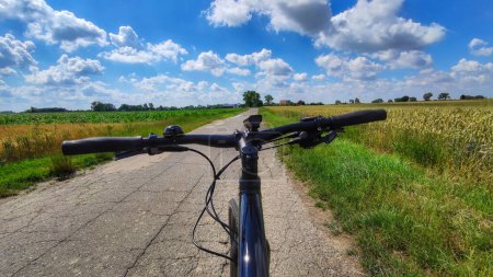 Gravel bicycle ride on the road in the summer season