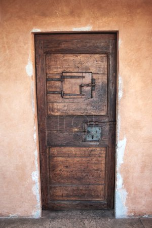 Old wooden door of a dungeon