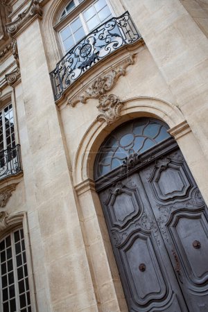 Facade of an old French mansion in Aix en Provence city