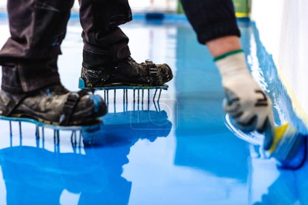 Photo for Self leveling blue epoxy floor in the gym - Royalty Free Image