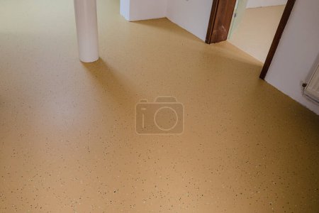 A medical facility with new decorative epoxy flooring. Colorful chips embedded in the seamless surface create a vibrant and durable solution.Selective focus