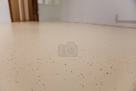 Photo for Top-down view showcases the stunning design and durability of new epoxy resin flooring. Perfect for high-traffic areas in commercial and industrial spaces. - Royalty Free Image