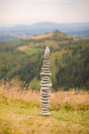 Photo for Columns of stones carefully balanced one on top of the other, displaying a sense of calm and concentration - Royalty Free Image