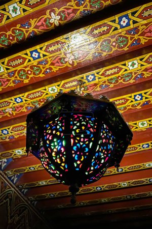 Photo for Traditional Moroccan lamp hanging on the ceiling of an old Riad in Morocco - Royalty Free Image