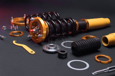 Photo for Suspension tuning, coilovers, shock absorbers and front springs in yellow and gold colors for a sports drift car on a dark background - Royalty Free Image