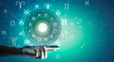 Photo for Astrological zodiac signs inside of horoscope circle on Mobile Technology. Astrology, knowledge of stars in the sky over the milky way and moon. Zodiac internet online concept. - Royalty Free Image