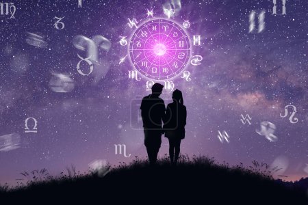 Photo for Astrological zodiac signs inside of horoscope circle. Couple singing and dancing over the zodiac wheel and milky way background. The power of the universe concept. - Royalty Free Image