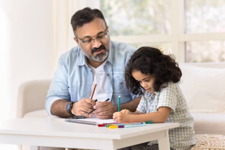 Photo for Focused Indian grandfather and cute granddaughter kid drawing creative colorful doodles in paper album together, developing art skills, creativity, hobby, doing school homework - Royalty Free Image