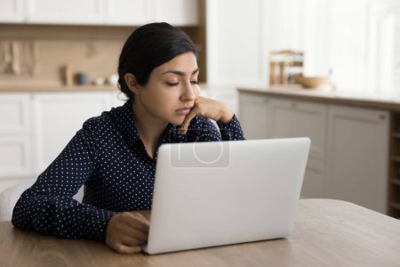 Photo for Tired sleepy Indian freelance woman sitting at home workplace table with closed eyes, sleeping at laptop, feeling exhausted, working on overtime task close to deadline through burnout, fatigue - Royalty Free Image