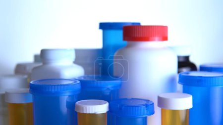 Photo for Various pills bottles macro close up shot. Production of medicines bottles. Pharmaceutical concept of healthcare, pharma industry, medication and drugs production. Medical research and trials. - Royalty Free Image