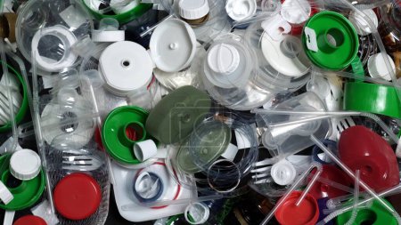 Photo for Plastic garbage from one household. Waste discarded or picked up from marine. City home trash made of plastic. Empty used bottles and cups create environmental pollution and ecological problem. - Royalty Free Image