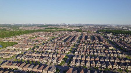 Photo for Panoramic view at established neighbourhood with town home cottage style houses in Canada. Top aerial view at middle class family homes with large backyard and green front yards. Very clean area. - Royalty Free Image