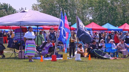 Photo for Display of flags at Two Spirits Pow wow. Trans or Transgender flag. Metis flag and missing in action POW MIA flag: Toronto, Ontario, Canada - May 27, 2023. - Royalty Free Image