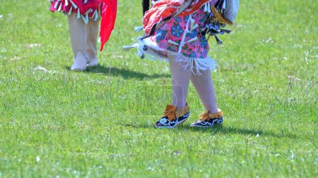 Photo for Pow Wow, 2nd Annual Two Spirit Powwow, by 2-Spirited People of the 1st Nations. Women traditional dance in Jingle Dress a shoes healing or medicine dress. - Royalty Free Image