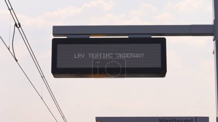 Photo for LRV Testing Underway sign, New Ionview station passenger shelter made of glass. Eglinton Crosstown LRT. Toronto, Ontario, Canada - June 7, 2023. - Royalty Free Image
