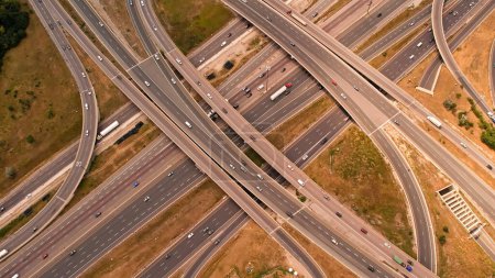 Photo for Highway aerial view. Speed ramps, expressway lanes roads and bridges. Aerial view of multilevel road junction with high speed moving cars. Road highway intersection interchange. - Royalty Free Image