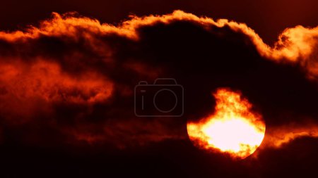 Photo for Red epic sunset through dark yellow orange clouds, cinematic skyline. - Royalty Free Image
