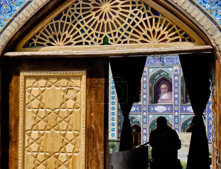 Photo for Tehran (Teheran), Iran 06.25.2023: Emamzadeh Saleh mosqeu entrange gate and imam  khomeini photo background. - Royalty Free Image