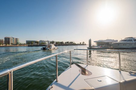 A luxurious yacht ride takes place in Al Raha near Yas Island, showcasing the tranquility and lavish lifestyle available in Abu Dhabi, UAE