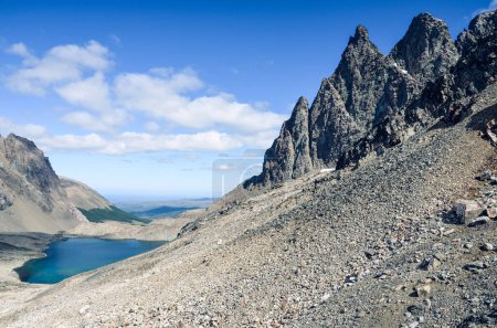 Photo for Alpine lake and the peaks in Dientes de Navarino in Chile, Patagonia, South America during a sunny day - Royalty Free Image