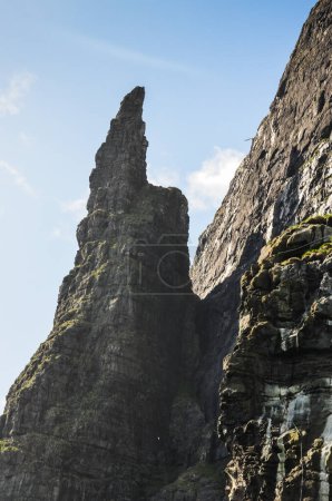 Dramatic cliffs Trollkonufingur, the witches finger, Vagar island, in Faroe Islands, Northern Europe, popular tourist travel destination