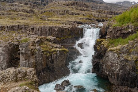The waterfall Nykurhylsfoss, also known as Sveinsstekksfoss, in southeast Iceland
