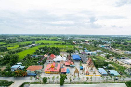 Photo for Aerial city view from flying drone at Wat Prem Prachakon ,Chiang Rak Noi, Bang Pa-in District, Phra Nakhon Si Ayutthaya,Thailan - Royalty Free Image