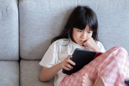 kid watching tablet, child addicted cartoo
