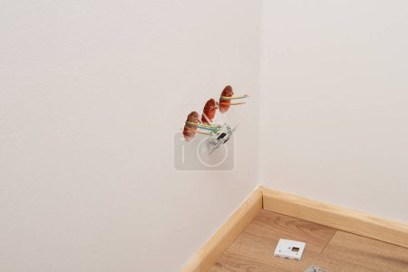 Photo for Work on installing electrical outlets. - Royalty Free Image