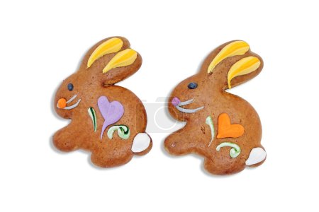 Photo for Two easter gingerbread cookies in the shape of a bunny isolated on a white background. - Royalty Free Image