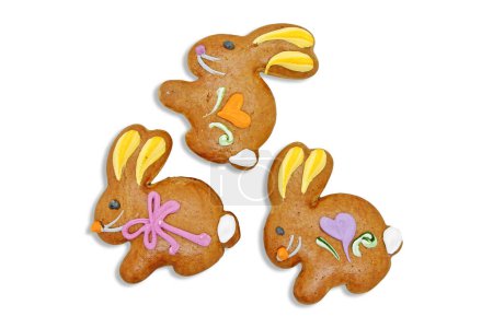 Photo for Three easter gingerbread cookies in the shape of a bunny isolated on a white background. - Royalty Free Image