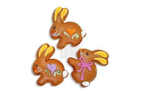 Photo for Three easter gingerbread cookies in the shape of a bunny isolated on a white background. - Royalty Free Image