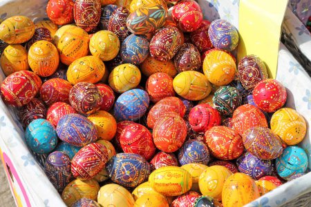 Photo for Traditional Czech easter eggs for sale at a market. Hand painted Easter eggs at a basket. - Royalty Free Image