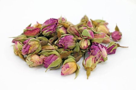 Photo for A pile of dry rose buds on a white background close-up. Studio shot. - Royalty Free Image