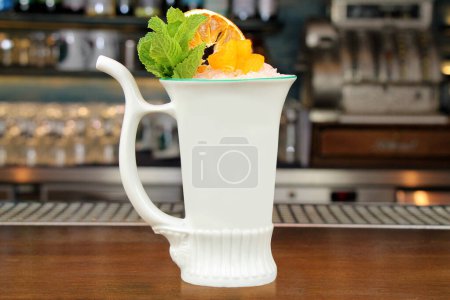 Photo for Cocktail in a spa cup at a bar counter background close-up. - Royalty Free Image