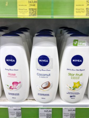 Photo for 01.10.2023 Ukraine, Kharkov Large range of Nivea brand shower gels on the shelves of a cosmetic store - Royalty Free Image