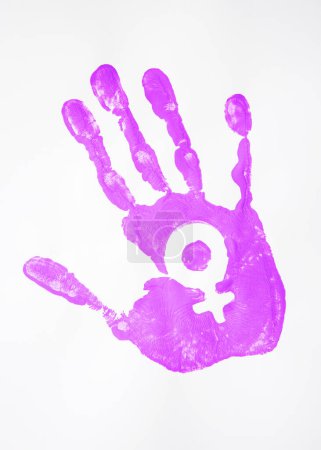 The imprint of a woman's palm is purple with the symbol of Venus on a white background. Purple as a symbol of the feminist movement for women's equality.