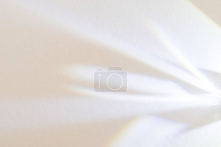 Shadow overlay effect on white. Abstract light background with shadows for use as a background in product photography.