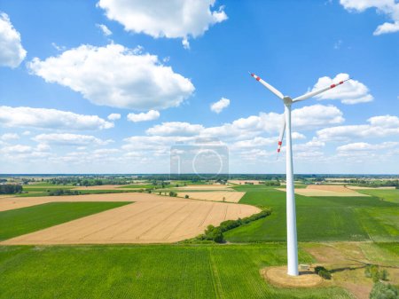 Photo for Aerial drone view of wind power turbines, part of a wind farm. Wind turbines on green field in countryside. Wind power plant. - Royalty Free Image