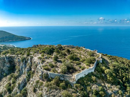 Ruins of the old Venetian fortress above the blue waters of Navarino beach in Greece