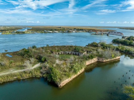 Aerial view of Fort Macomb near New Orleans, ruined historic brick fort with casemated bastions protecting access to Lake Pontchartrain in Louisiana with swing bridge over the water way