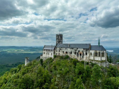 Photo for Aerial view of Bezdez Gothic medieval castle ruin in the Czech Republic with circular tower and palace - Royalty Free Image