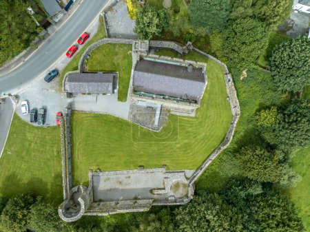 Photo for Aerial view of Athenry castle tower house dramatic three-storey hall-keep survives from the mid-thirteenth century, large, rectangular building with gabled roof and medieval walled town and priory in Ireland - Royalty Free Image
