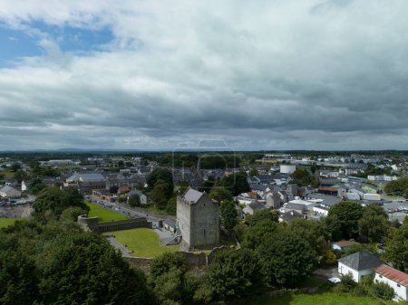 Photo for Aerial view of Athenry castle tower house dramatic three-storey hall-keep survives from the mid-thirteenth century, large, rectangular building with gabled roof and medieval walled town and priory in Ireland - Royalty Free Image