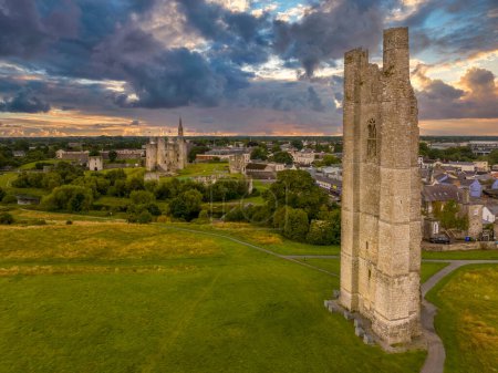 Photo for Aerial view of Trim castle, town and St Mary's Abbey ruined Gothic church tower with dramatic sunset sky in Ireland - Royalty Free Image
