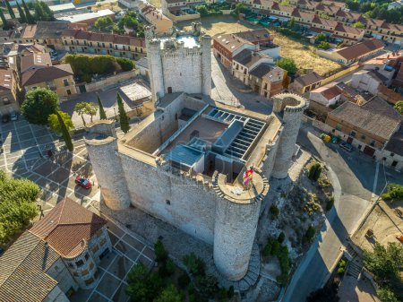 Photo for Aerial view of Torija medieval feudal castle in Guadalajara province Spain built by the templar knights. Rectangular structure with 3 round towers and a square keep with turrets made of limestone - Royalty Free Image